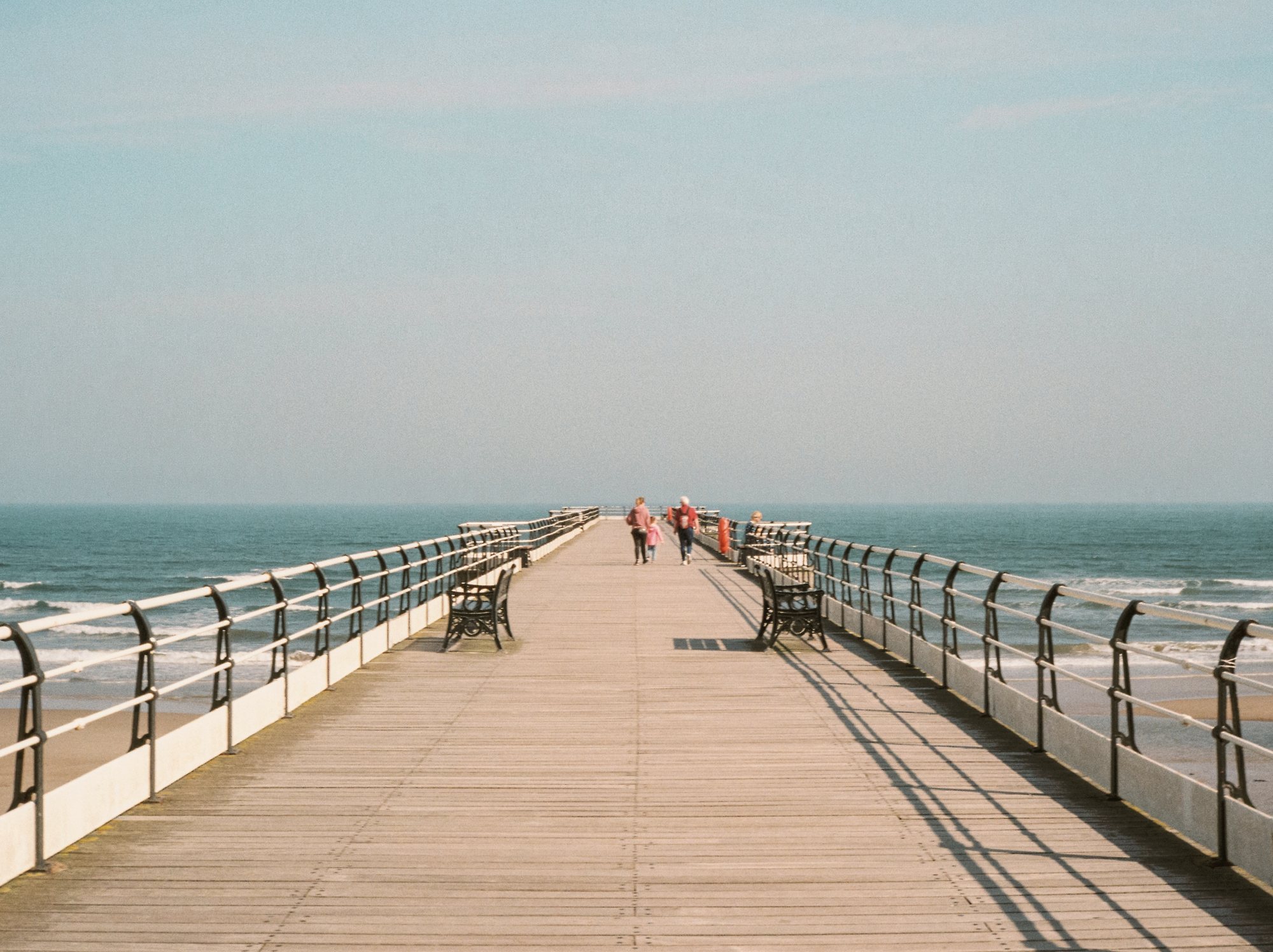 Looking along the deck of Saltburn pier towards the sea